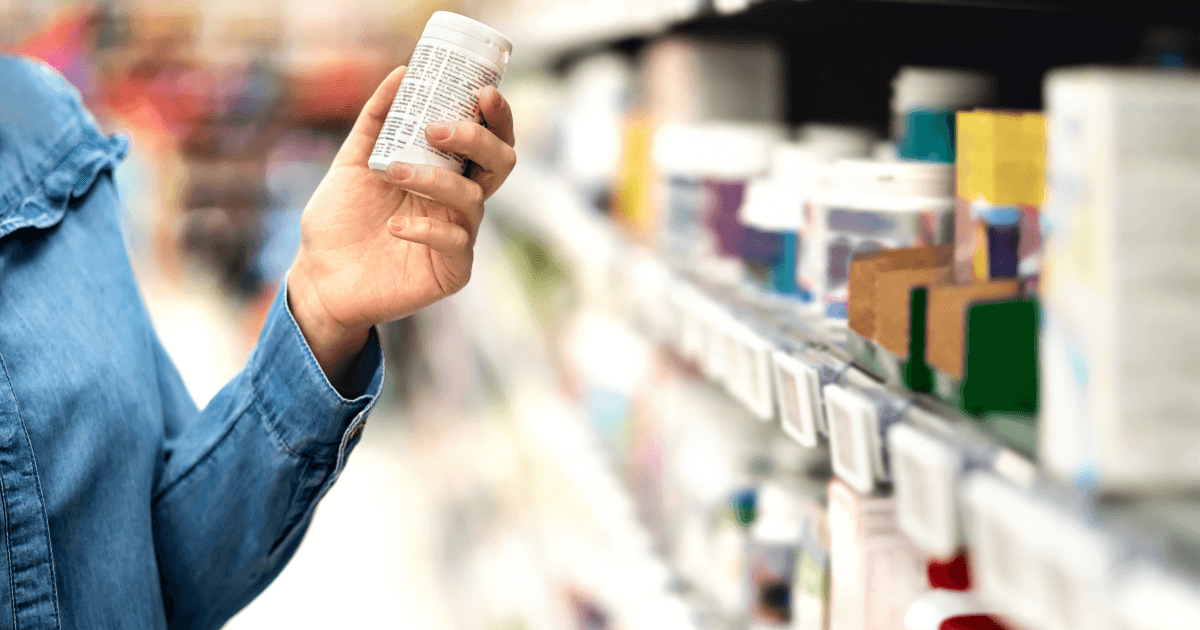 person holding bottle of meds..